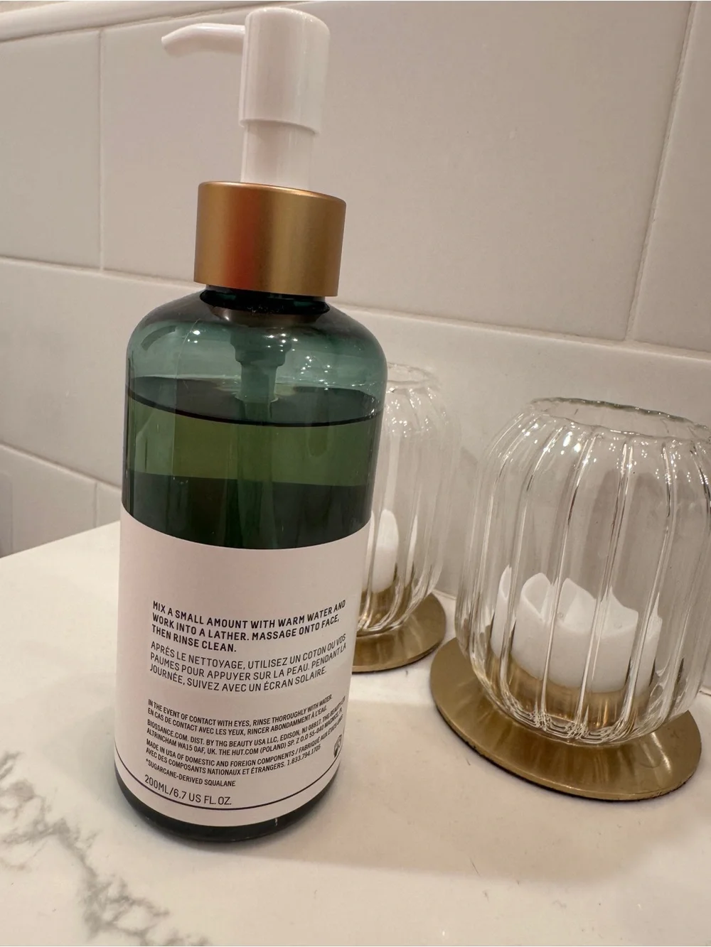 Biossance green and gold pump facial cleanser